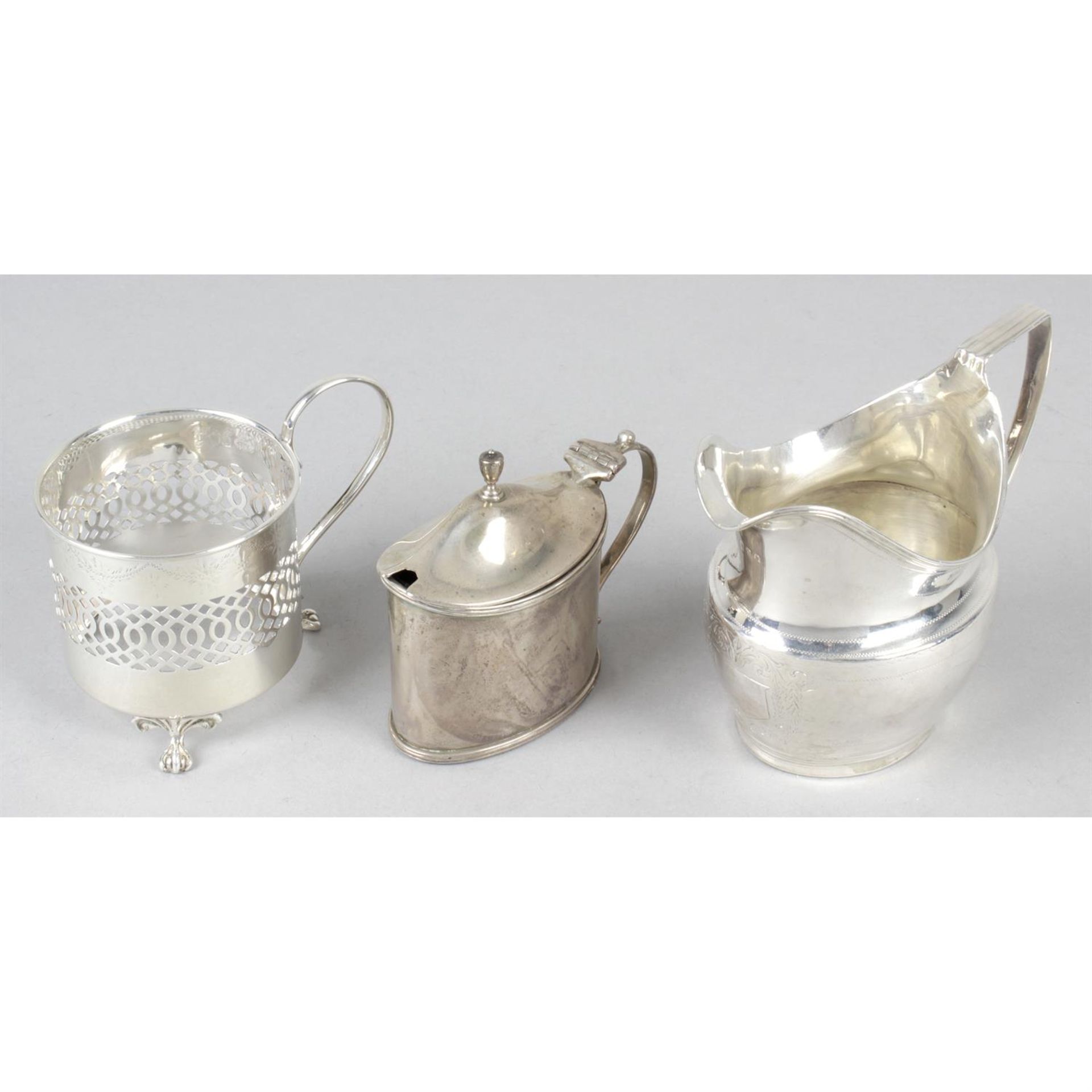 A George III silver cream jug, together with a late Victorian silver mustard pot and a 1920's