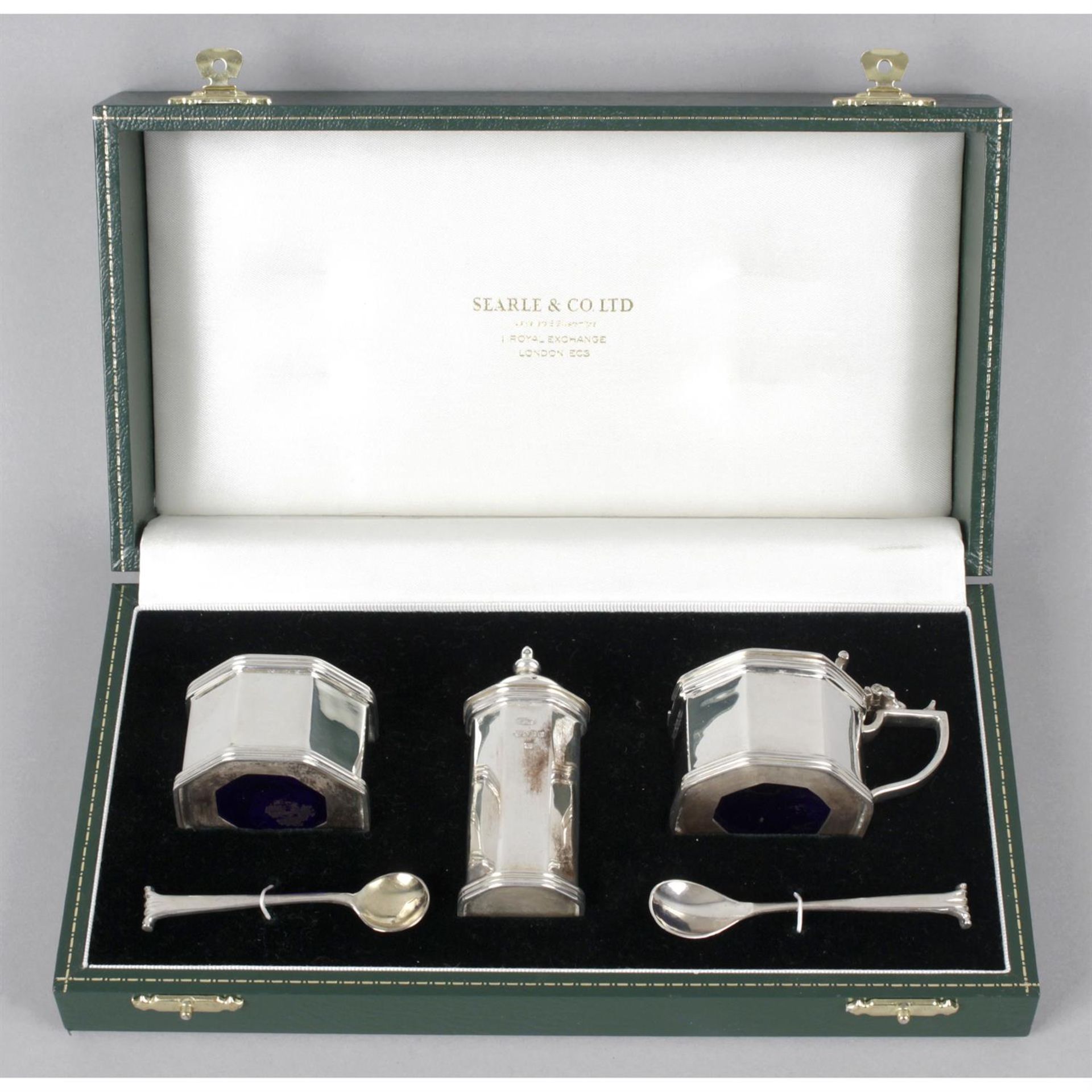 A modern silver three piece condiment set, in fitted case.