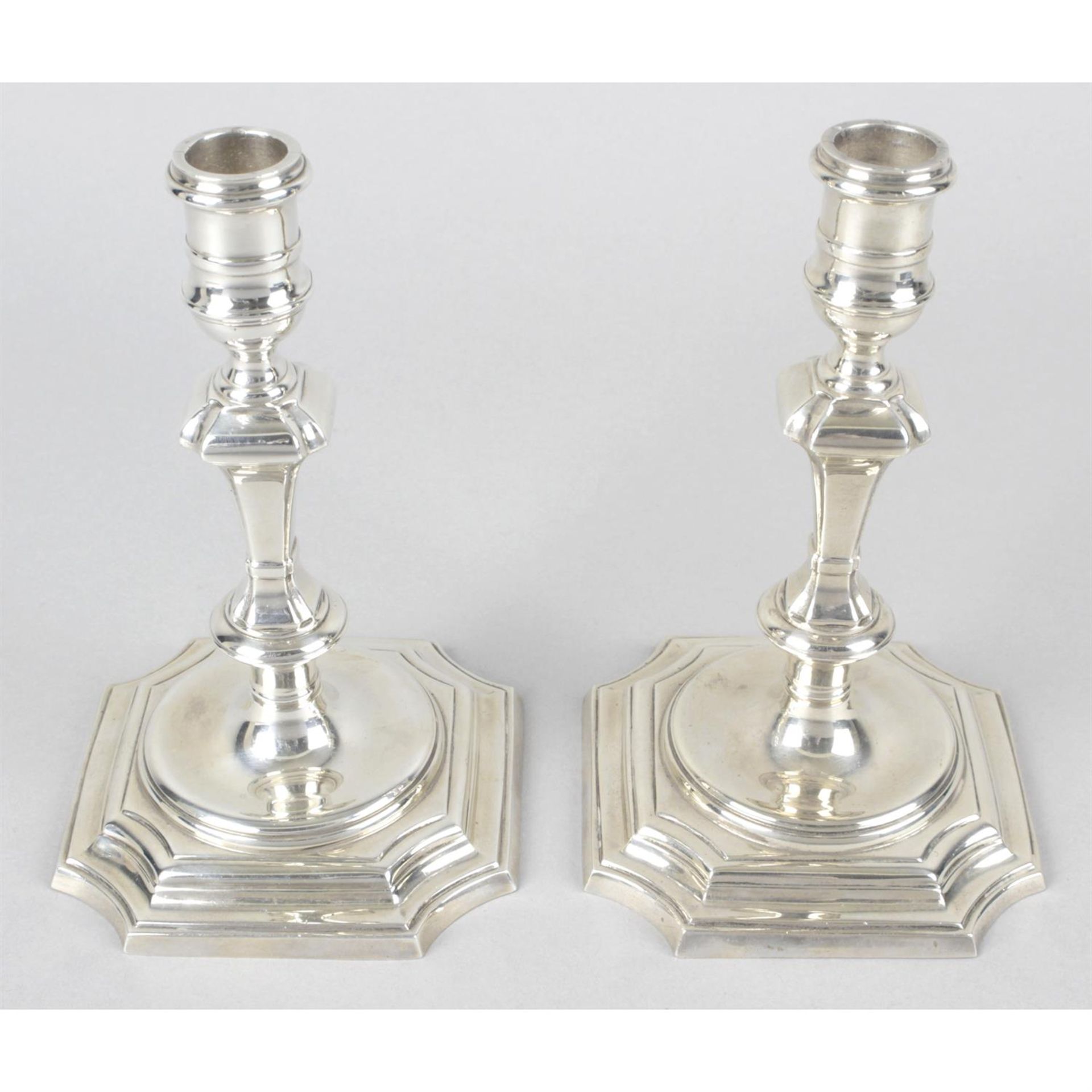 A pair of modern silver reproduction candlesticks.