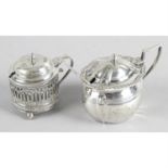 Three early 20th century silver mustard pots, together with a later example. (4).