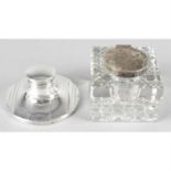 An early 20th century silver mounted capstan inkwell, together with a silver mounted glass inkwell.