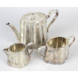 A late Victorian silver composite three piece tea set
