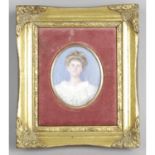 An early 20th century oval painted head and shoulder portrait miniature.