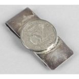 A Tiffany & Co sterling money clip applied with a One Dollar coin.