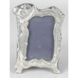 A modern silver mounted photograph frame with Art Nouveau style decoration.