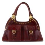 MIU MIU - a burgundy red leather carry bag..