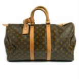 LOUIS VUITTON - a Monogram Keepall luggage bag.