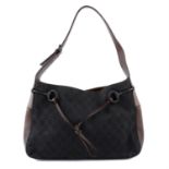 GUCCI - A vintage GG canvas horsebit shoulder handbag.