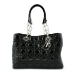 CHRISTIAN DIOR- A black leather Lady Dior handbag.