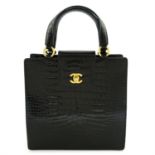 CHANEL - A black crocodile top handle handbag