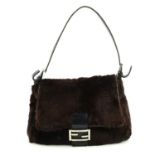 FENDI: A brown fur and leather Mamma bag.