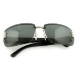GUCCI- a pair of black rimless sunglasses.