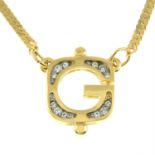 GIVENCHY - a colourless paste 'G' pendant, with chain.
