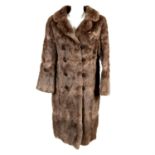 A light brown rabbit fur coat.