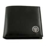 GUCCI- a black leather wallet.