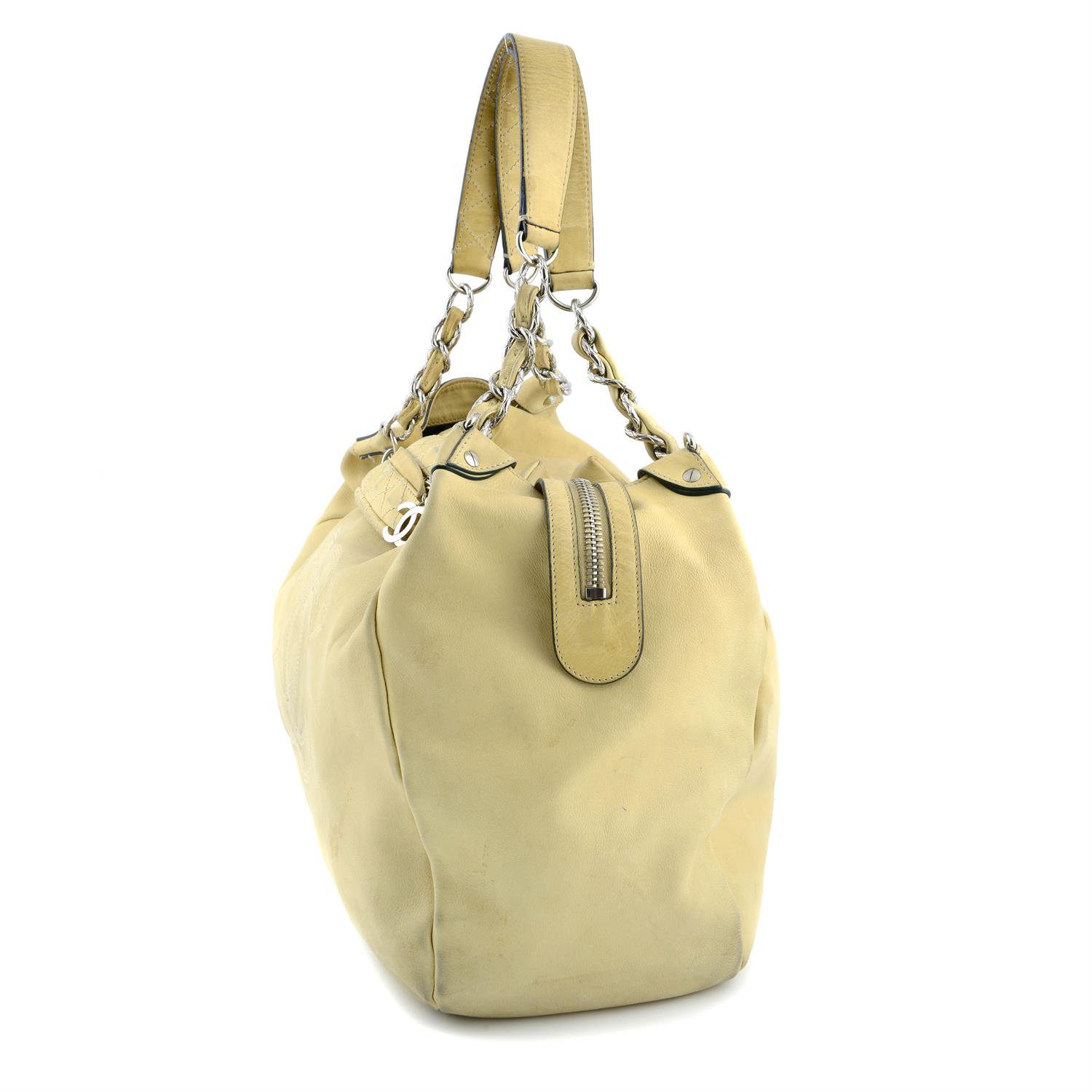 CHANEL - a beige hobo handbag. - Image 3 of 6