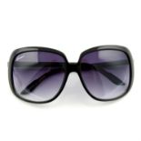 GUCCI- a pair of sunglasses.
