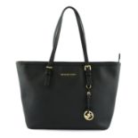 MICHAEL KORS- a black leather tote bag.