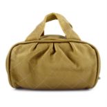 CHANEL - a gold-tone leather handbag.