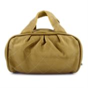 CHANEL - a gold-tone leather handbag.