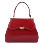 CHLOÉ - a red leather handbag.