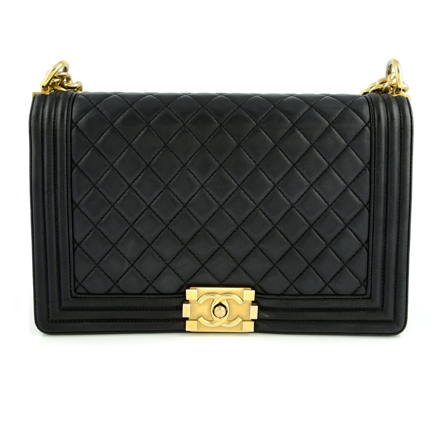 CHANEL - a black lambskin Boy flap bag.