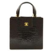 CHANEL - A brown crocodile top handle handbag