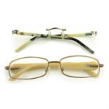 Two pairs of designer prescription glasses.