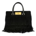 YVES SAINT LAURENT - A black suede handbag.