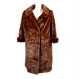 A brown mid length mink fur coat.