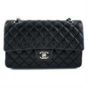 CHANEL - a black Classic Double Flap lamb skin leather handbag.