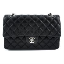 CHANEL - a black Classic Double Flap lamb skin leather handbag.