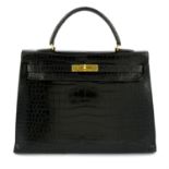 HERMÈS - a black crocodile Kelly 35 handbag.