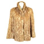 A light brown fox fur coat.