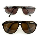 Two pairs of designer sunglasses by Maui Jim and Carrera.