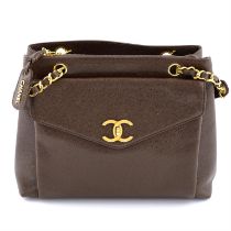 CHANEL - a vintage brown caviar leather handbag.