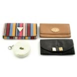 Three designer wallets and a coin purse.