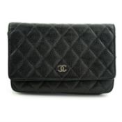 CHANEL - a black Caviar wallet on chain handbag.