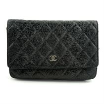 CHANEL - a black Caviar wallet on chain handbag.