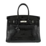 HERMÈS - a 2010 black Porosus Crocodile Birkin 35 handbag.