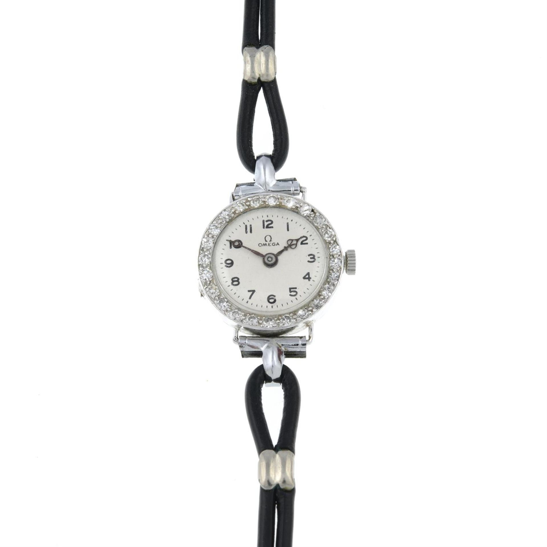 A lady's mid 20th century single-cut diamond bezel wrist watch, with black leather strap.