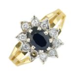An 18ct gold sapphire and brilliant-cut diamond cluster ring. AF.
