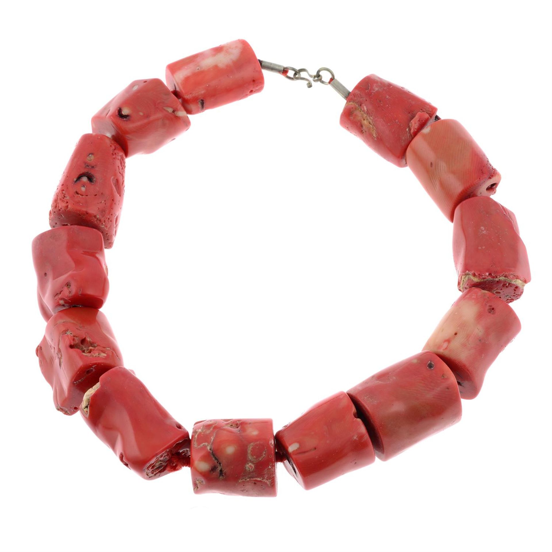 A dyed coral necklace.