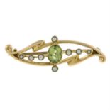 An Edwardian 15ct gold peridot and split pearl brooch.