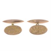 A pair of early 20th century 9ct gold cufflinks.