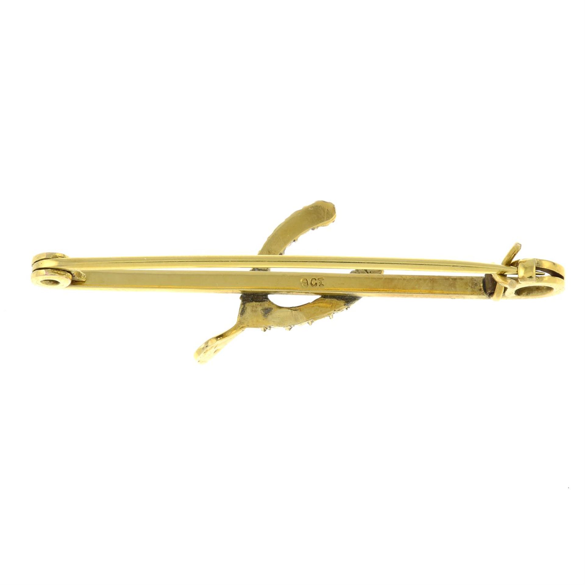An early 20th century 9ct gold split pearl horseshoe bar brooch. - Image 2 of 2