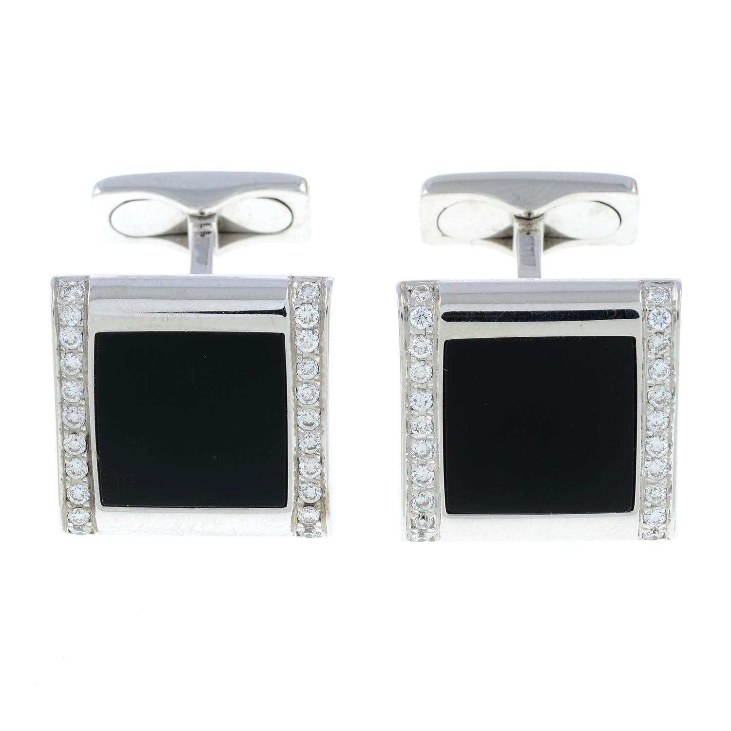 A pair of onyx and pavé-set diamond cufflinks.