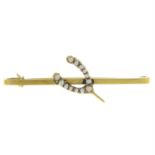 An early 20th century 9ct gold split pearl horseshoe bar brooch.