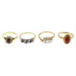 Four 9ct gold gem-set rings.