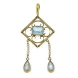 An aquamarine and seed pearl pendant.